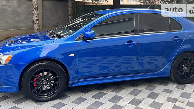 Синій Міцубісі Lancer, об'ємом двигуна 2 л та пробігом 133 тис. км за 12999 $, фото 14 на Automoto.ua