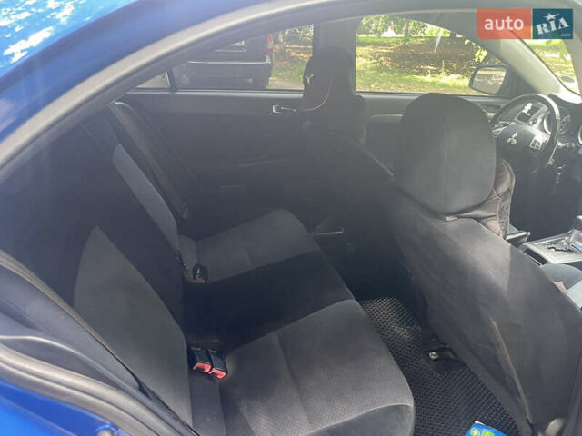Синій Міцубісі Lancer, об'ємом двигуна 2.4 л та пробігом 320 тис. км за 7700 $, фото 7 на Automoto.ua