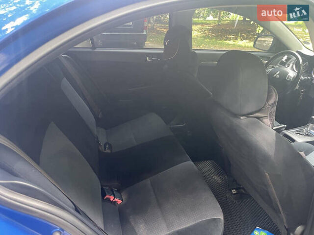 Синий Мицубиси Лансер, объемом двигателя 2.36 л и пробегом 320 тыс. км за 7700 $, фото 9 на Automoto.ua