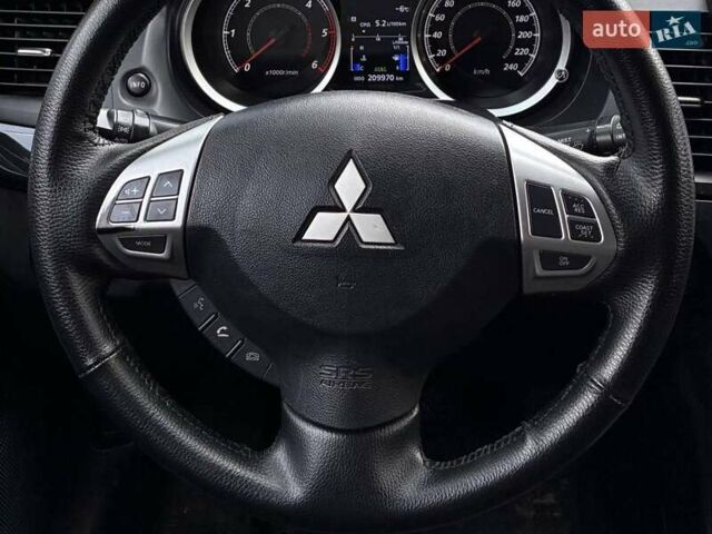 Синий Мицубиси Лансер, объемом двигателя 1.8 л и пробегом 210 тыс. км за 10200 $, фото 19 на Automoto.ua