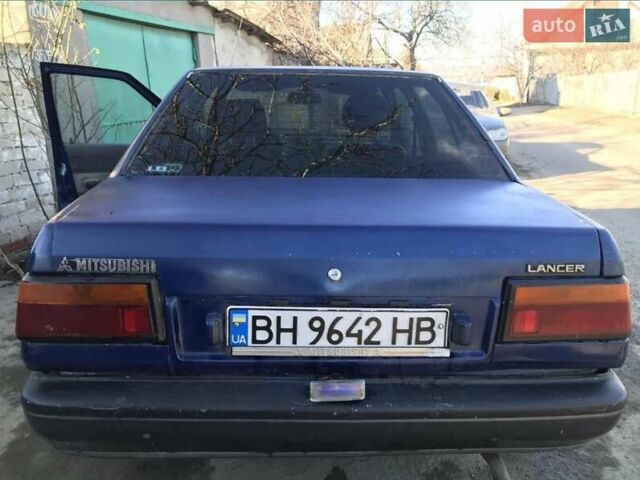Синий Мицубиси Лансер, объемом двигателя 1.8 л и пробегом 322 тыс. км за 800 $, фото 1 на Automoto.ua