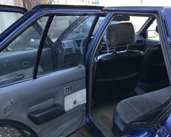 Синий Мицубиси Лансер, объемом двигателя 1.8 л и пробегом 322 тыс. км за 800 $, фото 2 на Automoto.ua