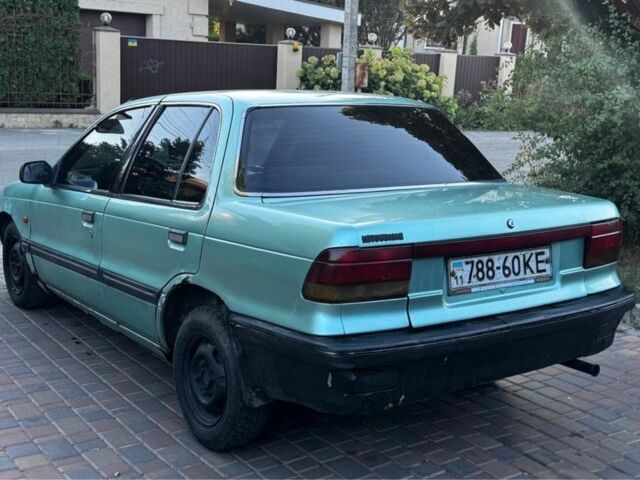 Синий Мицубиси Лансер, объемом двигателя 1.5 л и пробегом 300 тыс. км за 599 $, фото 9 на Automoto.ua