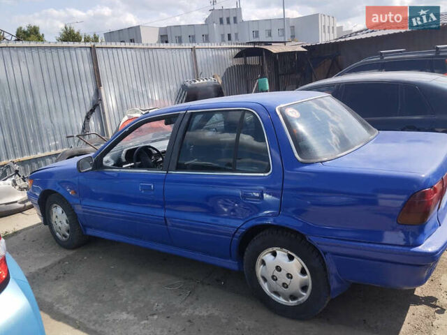 Синий Мицубиси Лансер, объемом двигателя 1.5 л и пробегом 300 тыс. км за 1300 $, фото 1 на Automoto.ua