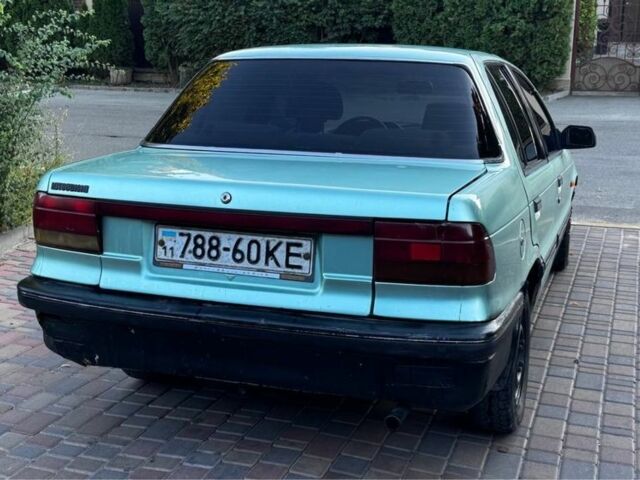 Синий Мицубиси Лансер, объемом двигателя 1.5 л и пробегом 300 тыс. км за 599 $, фото 5 на Automoto.ua