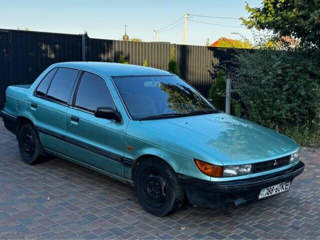 Синий Мицубиси Лансер, объемом двигателя 1.5 л и пробегом 300 тыс. км за 599 $, фото 3 на Automoto.ua