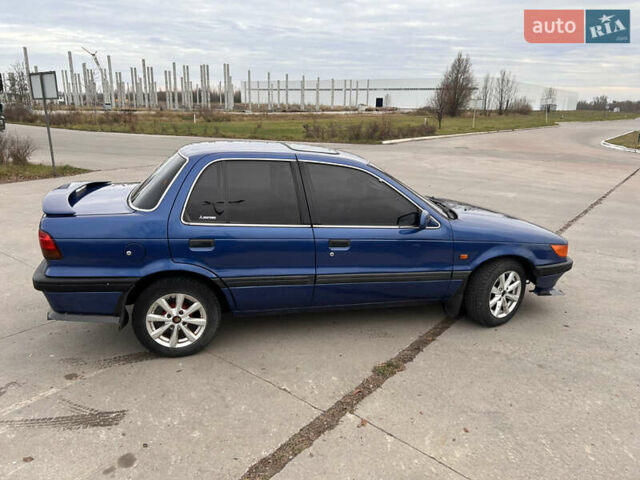 Синий Мицубиси Лансер, объемом двигателя 1.8 л и пробегом 245 тыс. км за 3000 $, фото 5 на Automoto.ua