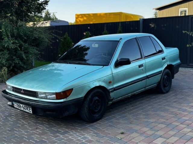 Синий Мицубиси Лансер, объемом двигателя 1.5 л и пробегом 300 тыс. км за 599 $, фото 8 на Automoto.ua