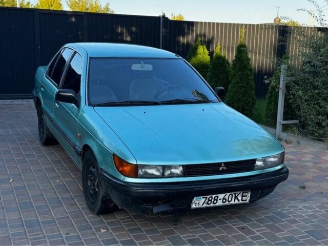 Синий Мицубиси Лансер, объемом двигателя 1.5 л и пробегом 300 тыс. км за 599 $, фото 4 на Automoto.ua