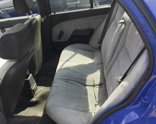 Синий Мицубиси Лансер, объемом двигателя 1.5 л и пробегом 300 тыс. км за 1300 $, фото 5 на Automoto.ua