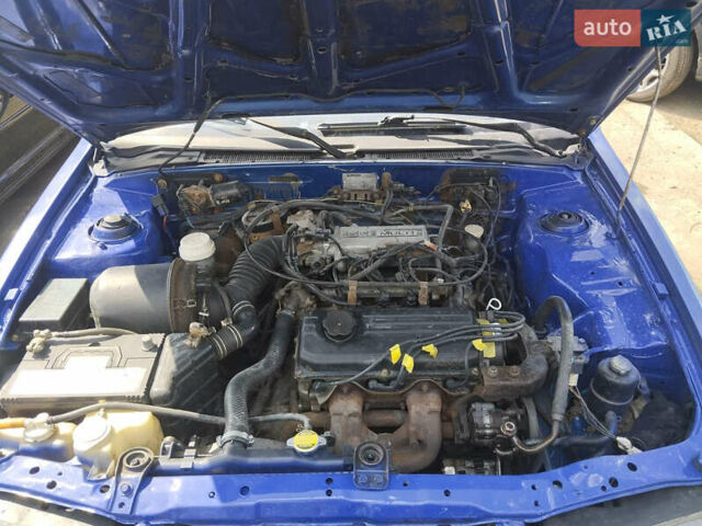 Синий Мицубиси Лансер, объемом двигателя 1.5 л и пробегом 300 тыс. км за 1300 $, фото 3 на Automoto.ua