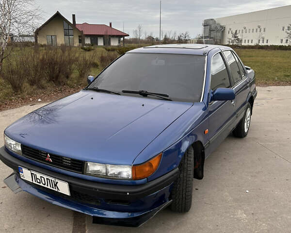 Синий Мицубиси Лансер, объемом двигателя 1.8 л и пробегом 245 тыс. км за 3000 $, фото 1 на Automoto.ua