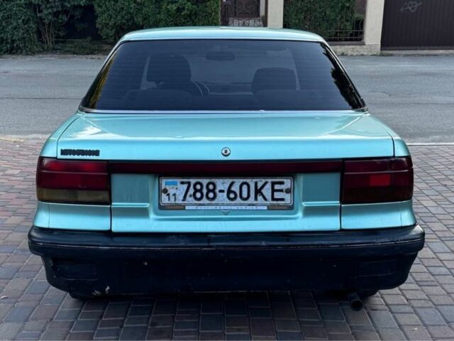 Синий Мицубиси Лансер, объемом двигателя 1.5 л и пробегом 300 тыс. км за 599 $, фото 6 на Automoto.ua