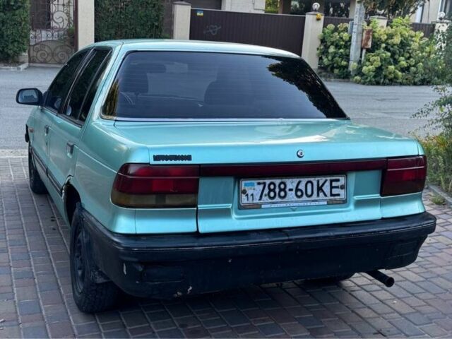 Синий Мицубиси Лансер, объемом двигателя 1.5 л и пробегом 300 тыс. км за 599 $, фото 7 на Automoto.ua