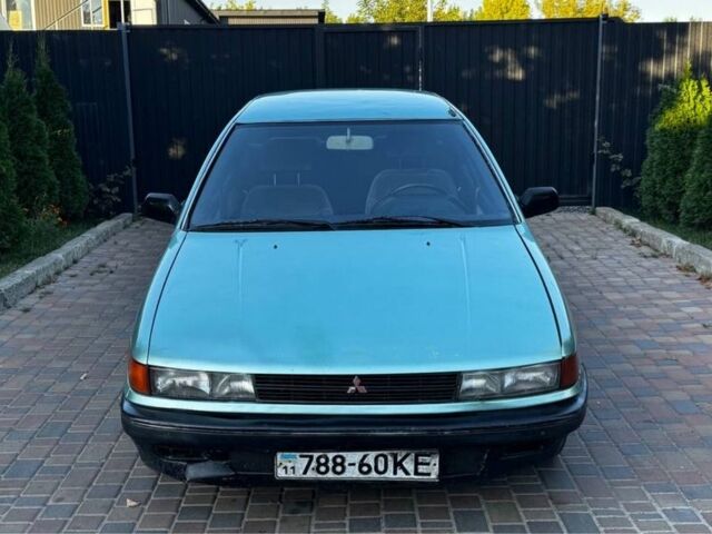 Синий Мицубиси Лансер, объемом двигателя 1.5 л и пробегом 300 тыс. км за 599 $, фото 1 на Automoto.ua