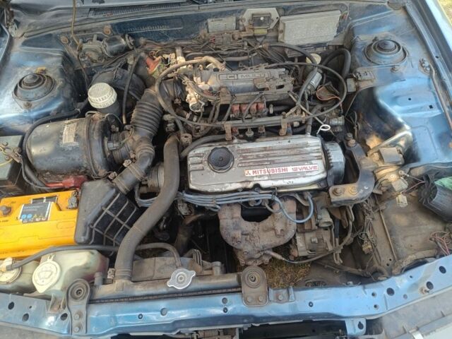 Синий Мицубиси Лансер, объемом двигателя 1.5 л и пробегом 450 тыс. км за 999 $, фото 8 на Automoto.ua