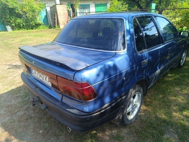 Синий Мицубиси Лансер, объемом двигателя 1.5 л и пробегом 450 тыс. км за 999 $, фото 5 на Automoto.ua