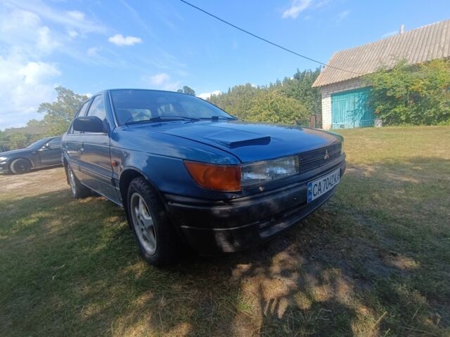 Синий Мицубиси Лансер, объемом двигателя 1.5 л и пробегом 450 тыс. км за 999 $, фото 1 на Automoto.ua