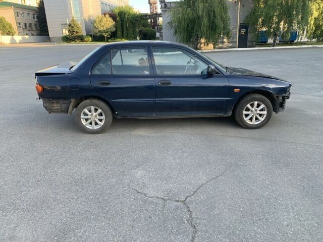 Синий Мицубиси Лансер, объемом двигателя 1.3 л и пробегом 250 тыс. км за 800 $, фото 7 на Automoto.ua