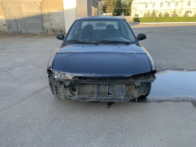 Синий Мицубиси Лансер, объемом двигателя 1.3 л и пробегом 250 тыс. км за 800 $, фото 1 на Automoto.ua