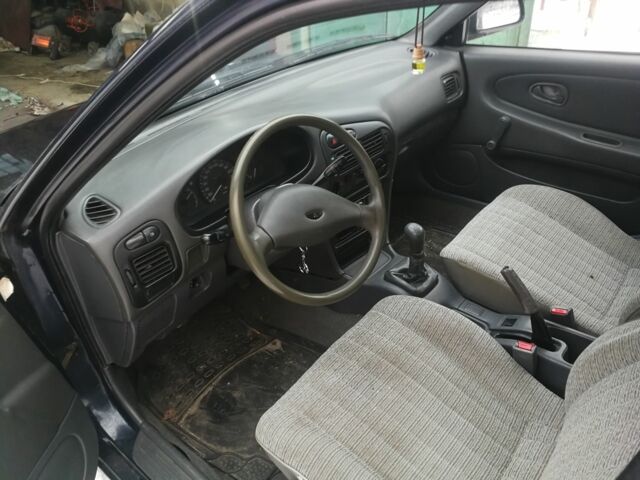 Синий Мицубиси Лансер, объемом двигателя 1.3 л и пробегом 250 тыс. км за 1450 $, фото 5 на Automoto.ua