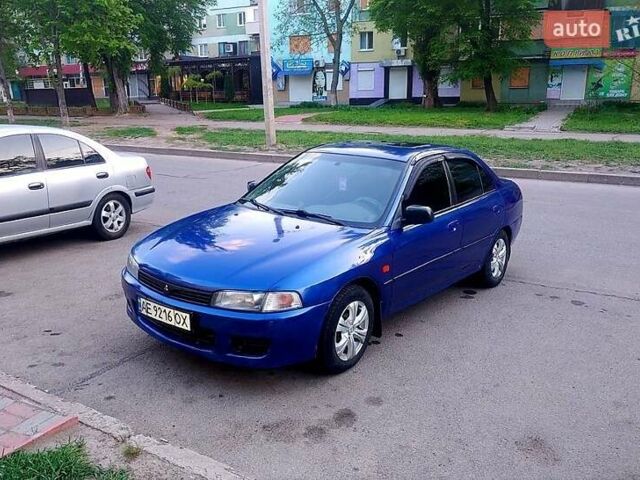 Синий Мицубиси Лансер, объемом двигателя 1.3 л и пробегом 270 тыс. км за 2100 $, фото 1 на Automoto.ua