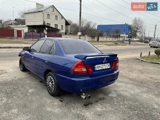 Синий Мицубиси Лансер, объемом двигателя 1.3 л и пробегом 250 тыс. км за 1000 $, фото 6 на Automoto.ua