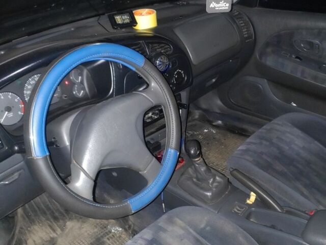 Синий Мицубиси Лансер, объемом двигателя 1.3 л и пробегом 270 тыс. км за 2100 $, фото 3 на Automoto.ua