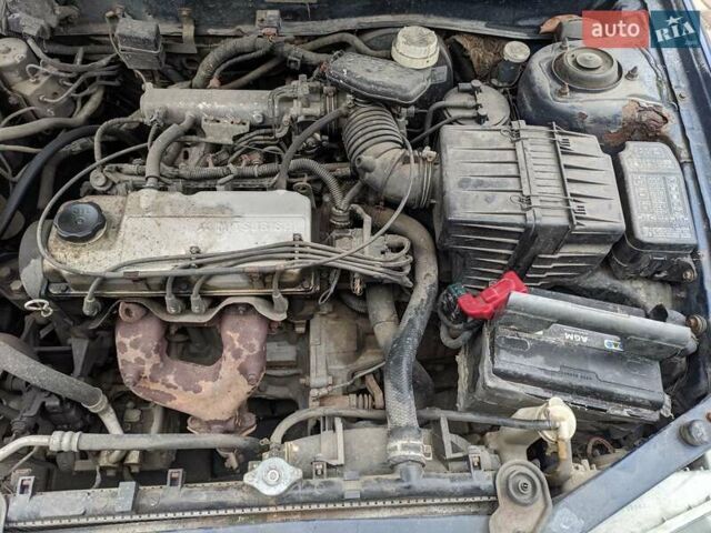 Синій Міцубісі Lancer, об'ємом двигуна 1.3 л та пробігом 250 тис. км за 2100 $, фото 6 на Automoto.ua