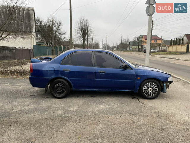 Синий Мицубиси Лансер, объемом двигателя 1.3 л и пробегом 250 тыс. км за 1000 $, фото 4 на Automoto.ua