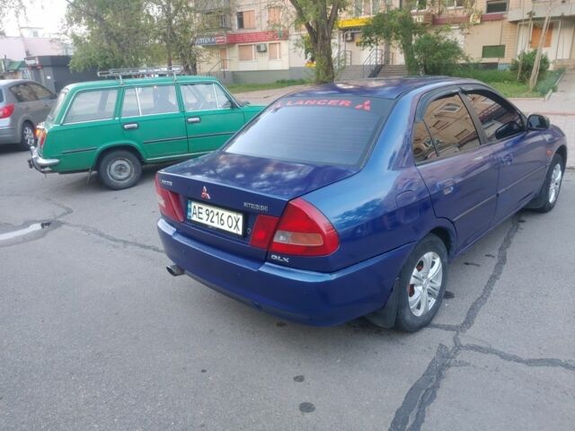 Синий Мицубиси Лансер, объемом двигателя 1.3 л и пробегом 270 тыс. км за 2100 $, фото 1 на Automoto.ua