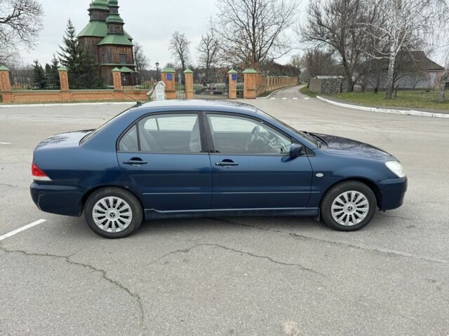 Синий Мицубиси Лансер, объемом двигателя 1.6 л и пробегом 182 тыс. км за 3500 $, фото 5 на Automoto.ua