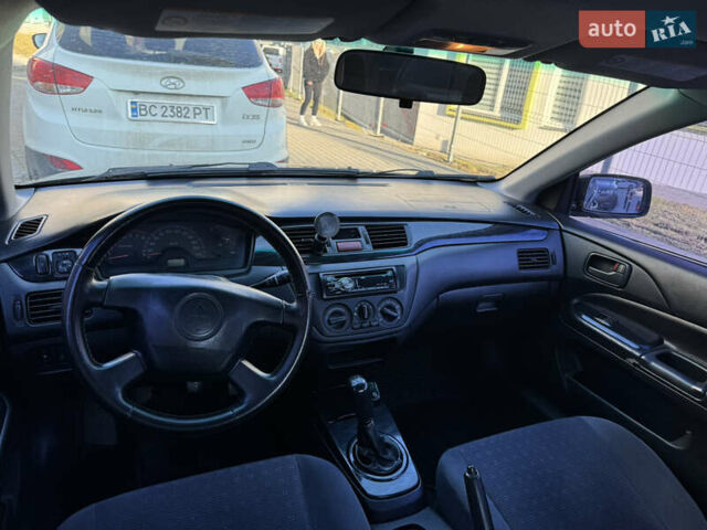 Синій Міцубісі Lancer, об'ємом двигуна 1.6 л та пробігом 400 тис. км за 2600 $, фото 12 на Automoto.ua