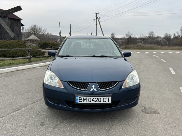 Синий Мицубиси Лансер, объемом двигателя 1.6 л и пробегом 182 тыс. км за 3500 $, фото 7 на Automoto.ua