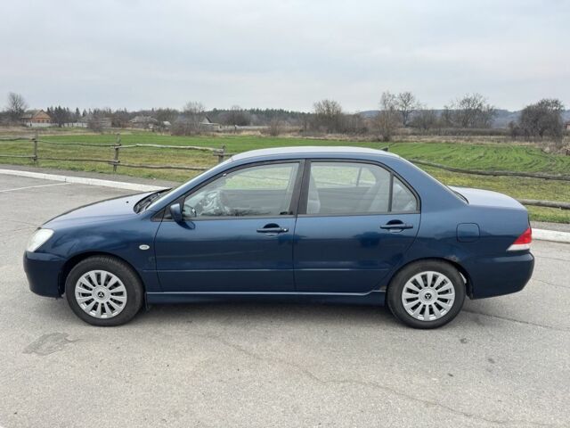 Синий Мицубиси Лансер, объемом двигателя 1.6 л и пробегом 182 тыс. км за 3500 $, фото 1 на Automoto.ua