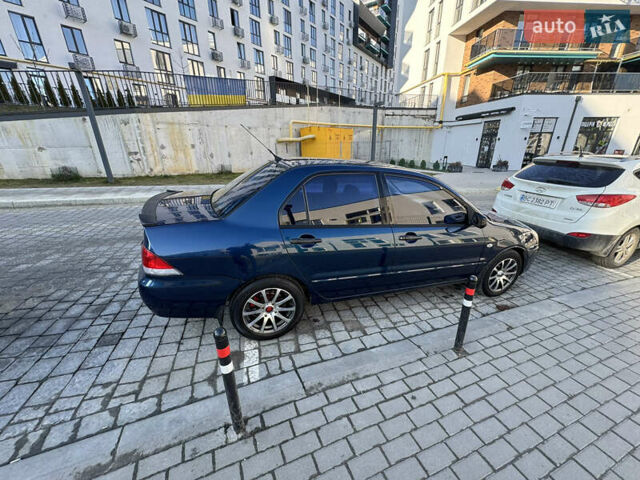 Синій Міцубісі Lancer, об'ємом двигуна 1.6 л та пробігом 400 тис. км за 2600 $, фото 6 на Automoto.ua