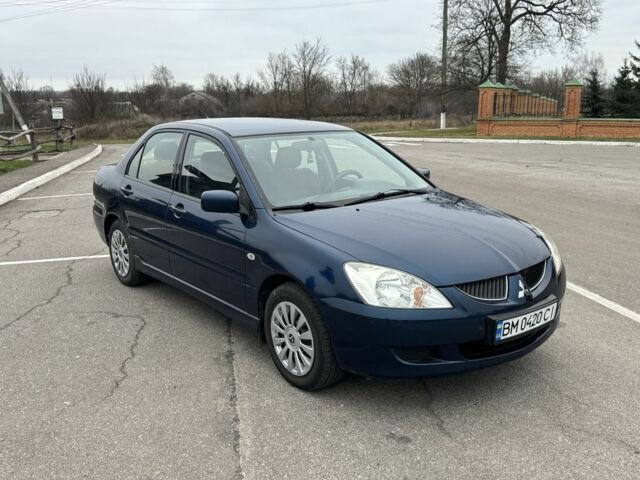 Синий Мицубиси Лансер, объемом двигателя 1.6 л и пробегом 182 тыс. км за 3500 $, фото 6 на Automoto.ua