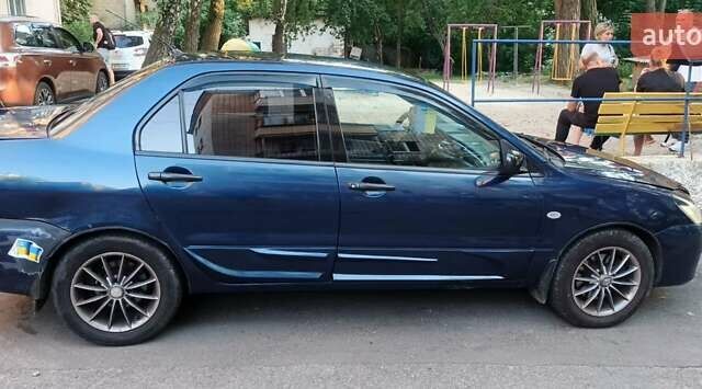 Синий Мицубиси Лансер, объемом двигателя 1.58 л и пробегом 411 тыс. км за 3000 $, фото 10 на Automoto.ua