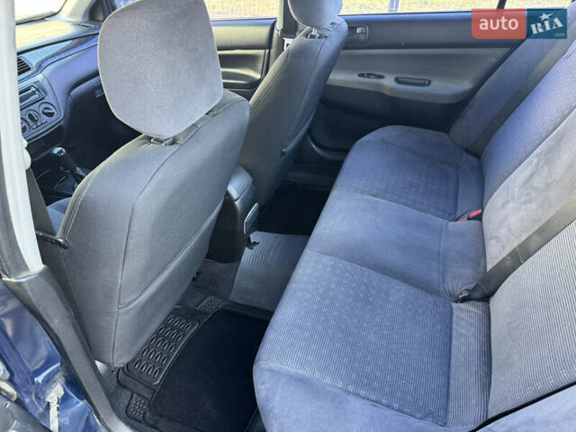Синій Міцубісі Lancer, об'ємом двигуна 1.6 л та пробігом 400 тис. км за 2600 $, фото 13 на Automoto.ua
