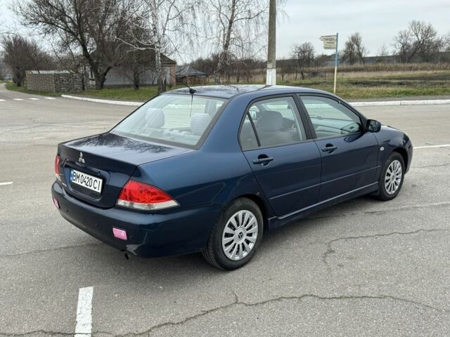 Синий Мицубиси Лансер, объемом двигателя 1.6 л и пробегом 182 тыс. км за 3500 $, фото 4 на Automoto.ua