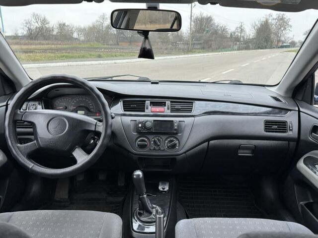 Синий Мицубиси Лансер, объемом двигателя 1.6 л и пробегом 182 тыс. км за 3500 $, фото 10 на Automoto.ua