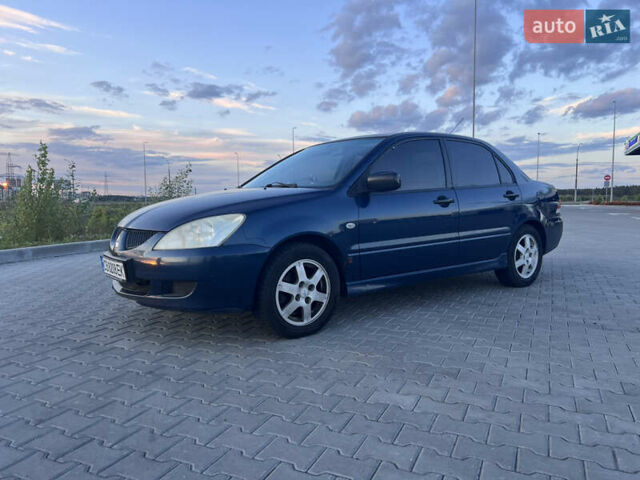 Синий Мицубиси Лансер, объемом двигателя 1.3 л и пробегом 290 тыс. км за 2999 $, фото 3 на Automoto.ua