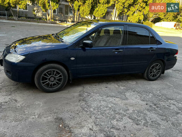 Синій Міцубісі Lancer, об'ємом двигуна 1.58 л та пробігом 324 тис. км за 4150 $, фото 1 на Automoto.ua
