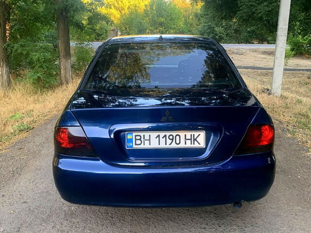 Синий Мицубиси Лансер, объемом двигателя 1.6 л и пробегом 295 тыс. км за 4550 $, фото 6 на Automoto.ua