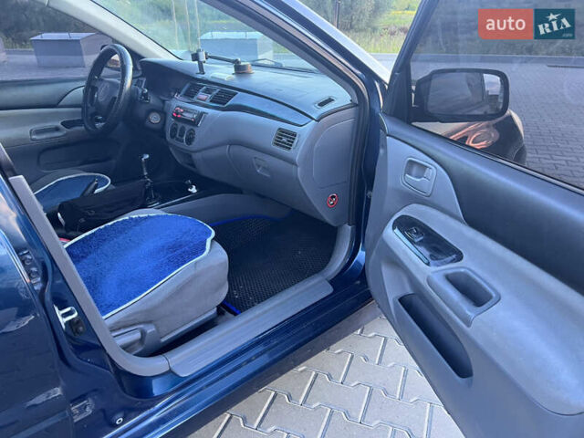 Синий Мицубиси Лансер, объемом двигателя 1.3 л и пробегом 290 тыс. км за 2999 $, фото 19 на Automoto.ua