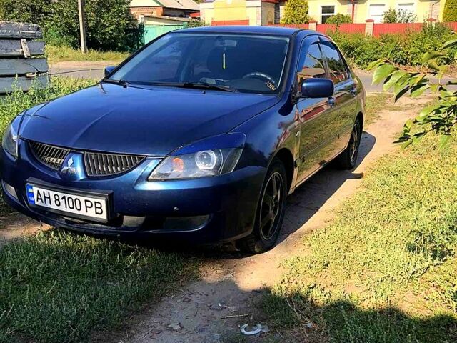 Синій Міцубісі Lancer, об'ємом двигуна 1.6 л та пробігом 248 тис. км за 4200 $, фото 12 на Automoto.ua