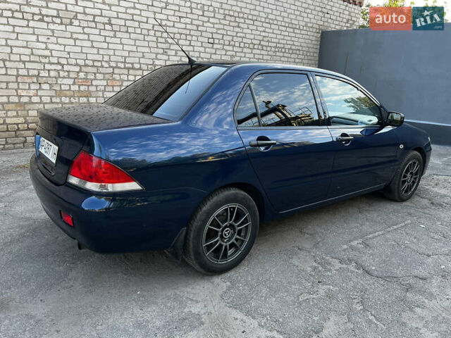 Синій Міцубісі Lancer, об'ємом двигуна 1.58 л та пробігом 324 тис. км за 4150 $, фото 6 на Automoto.ua