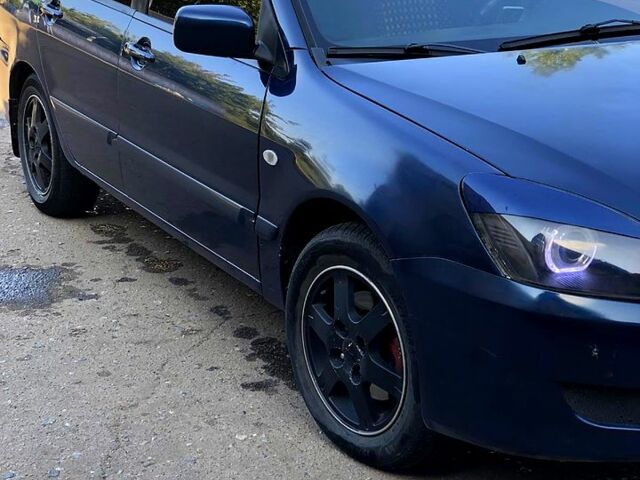 Синій Міцубісі Lancer, об'ємом двигуна 1.6 л та пробігом 248 тис. км за 4200 $, фото 4 на Automoto.ua
