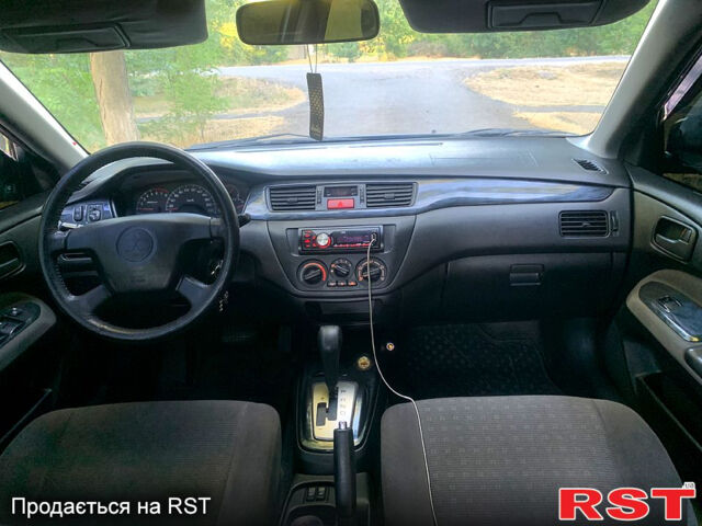 Синий Мицубиси Лансер, объемом двигателя 1.6 л и пробегом 295 тыс. км за 4550 $, фото 10 на Automoto.ua