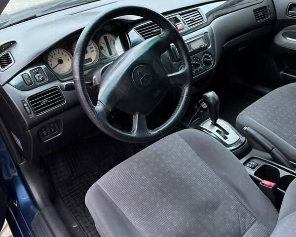 Синій Міцубісі Lancer, об'ємом двигуна 1.6 л та пробігом 200 тис. км за 5000 $, фото 8 на Automoto.ua